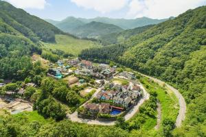 an aerial view of a house in the mountains at Gapyeong Green Star Pension Remodeling, Spa in Gapyeong