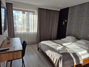 Posteľ alebo postele v izbe v ubytovaní Apartament Mountains Góry Sowie