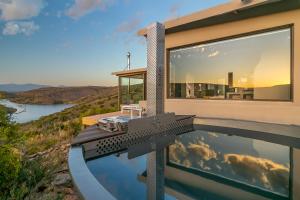 an image of a house with a swimming pool at Aardvark Bioreserve in Ladismith