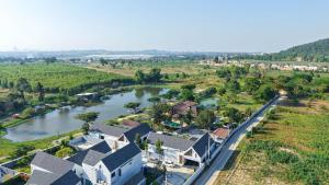 an aerial view of a house next to a river at Anya pool villa pattaya in Ban Huai Yai