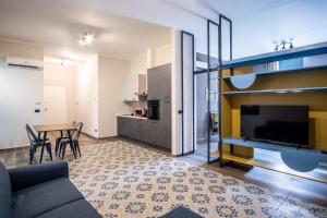 a living room with a couch and a table at Palazzo Zippitelli Apartments in Bari