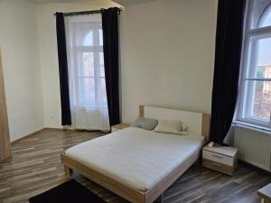 Postel nebo postele na pokoji v ubytování Designer Rooms Andrassy + 5 fotografií