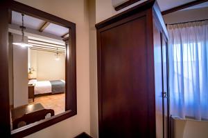 Posteľ alebo postele v izbe v ubytovaní Hotel Tharsis