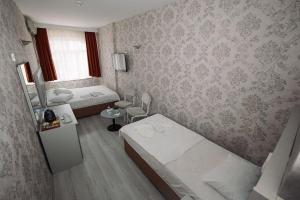 Postel nebo postele na pokoji v ubytování Topkapi Golden Time Hotel