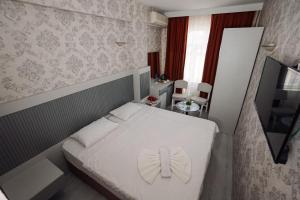 Postel nebo postele na pokoji v ubytování Topkapi Golden Time Hotel