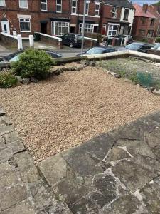 a garden of rocks and dirt in a yard at Rotherham Meadowhall in Rotherham +11 photos