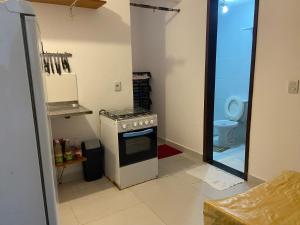 Kuchyň nebo kuchyňský kout v ubytování Apartamento - Villa de Praia do Forte