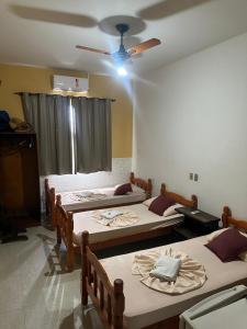 Rúm í herbergi á HOTEL LAREIRA