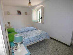 Postel nebo postele na pokoji v ubytování Villa L'isola