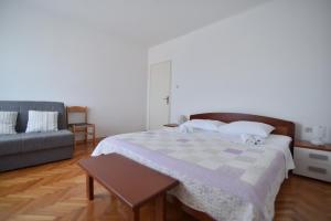 Postel nebo postele na pokoji v ubytování Apartmani Badurina - Maslina