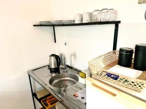 Kuchyň nebo kuchyňský kout v ubytování Cabaña frente a las dunas, a 5 minutos de Mundo Marino y Termas Marinas + 2 fotografie