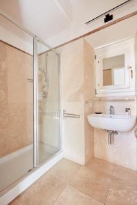 a bathroom with a shower and a sink at Montevecchio Boutique Apartments in Rome