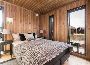 Ένα ή περισσότερα κρεβάτια σε δωμάτιο στο Modern cabin Hafjell high standard ski-in out