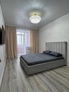 Ένα ή περισσότερα κρεβάτια σε δωμάτιο στο Rich home