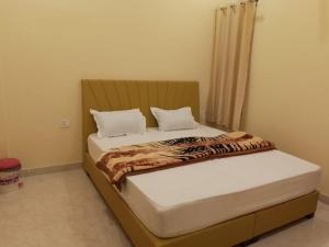 Postel nebo postele na pokoji v ubytování Hotel Palace Khatushyamji