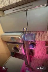 a bathroom with a sink and a toilet in a room at Panorama Elsherouk Furnished 2 bedroom apartment in Madīnat ash Shurūq