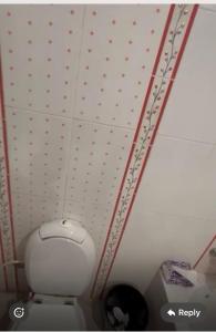 a bathroom with a white toilet in a room at Panorama Elsherouk Furnished 2 bedroom apartment in Madīnat ash Shurūq +5 photos