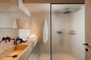 a bathroom with a glass shower and a sink at master Trevi in Rome +53 photos