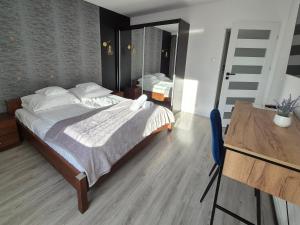 Posteľ alebo postele v izbe v ubytovaní Apartament Mountains Góry Sowie