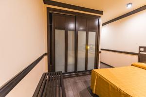 Postel nebo postele na pokoji v ubytování Hotel Machaco