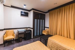 TV a/nebo společenská místnost v ubytování Hotel Machaco