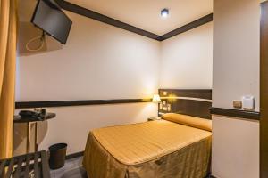TV a/nebo společenská místnost v ubytování Hotel Machaco