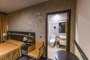Postel nebo postele na pokoji v ubytování Hotel Machaco