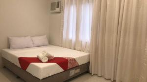 Postel nebo postele na pokoji v ubytování OYO 1128 Hotel Sangco