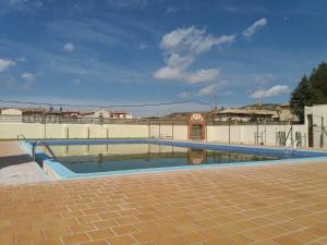 a swimming pool in the middle of a building at La Casa Amarilla in Rubielos de Mora