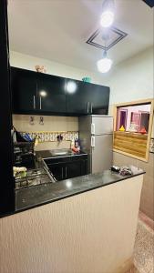 Kuchyň nebo kuchyňský kout v ubytování Appartement au centre de TIZNIT