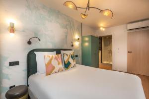 Ένα ή περισσότερα κρεβάτια σε δωμάτιο στο West Paris Suite