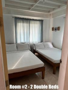 Katil atau katil-katil dalam bilik di Coza Inn