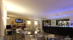 TV a/nebo společenská místnost v ubytování Hotel Al Posta