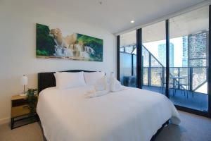 Katil atau katil-katil dalam bilik di New and Modern 2BR Gem in Rundle Mall