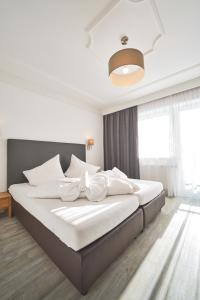 Łóżko lub łóżka w pokoju w obiekcie Hotel Gamshag