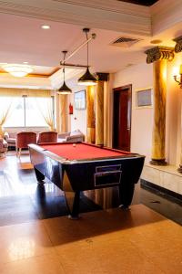 a billiard room with a pool table in a room at Cesar Palace Sousse in Sousse