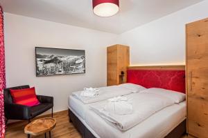 Posteľ alebo postele v izbe v ubytovaní Berghotel Schmittenhöhe - 2000m