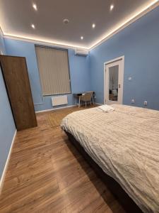 Ένα ή περισσότερα κρεβάτια σε δωμάτιο στο Benny & Bella Apartman City