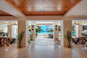 a lobby of a resort with a wooden ceiling at Shangri-La Le Touessrok, Mauritius in Trou d'Eau Douce