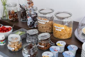 a bunch of jars of food on a table at B&B I LAKE IT BELLAGIO in Bellagio