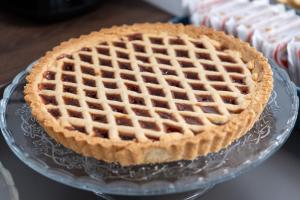 a pie on a glass plate with a waffle at B&B I LAKE IT BELLAGIO in Bellagio