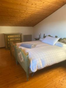 A bed or beds in a room at La casa di nonno carlo