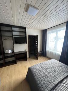 Postel nebo postele na pokoji v ubytování U Stozi Hotel