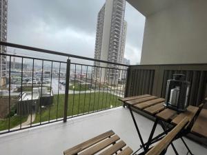 a balcony with a bench and a view of a city at Belgrade Waterfront River View Apartments in Belgrade