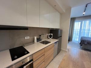 a kitchen with a sink and a counter top at Belgrade Waterfront River View Apartments in Belgrade
