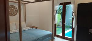 Postel nebo postele na pokoji v ubytování Seminyak great Location Villa