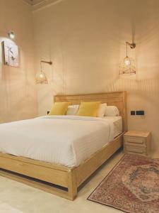 Postel nebo postele na pokoji v ubytování Olitas House Nias