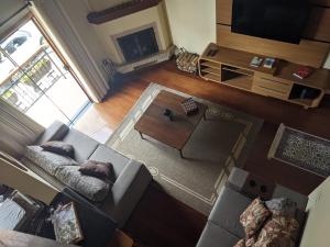 Χώρος καθιστικού στο Caluan Apartment