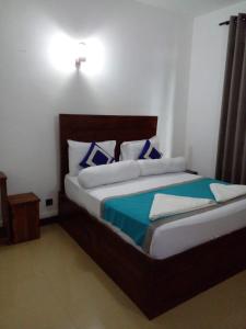 Voodi või voodid majutusasutuse Wilroma Hotel&Resort toas