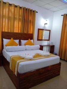 Voodi või voodid majutusasutuse Wilroma Hotel&Resort toas